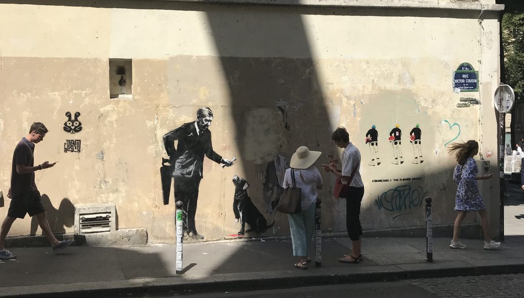 Rue victor Cousin with Businessman with a saw by Banksy