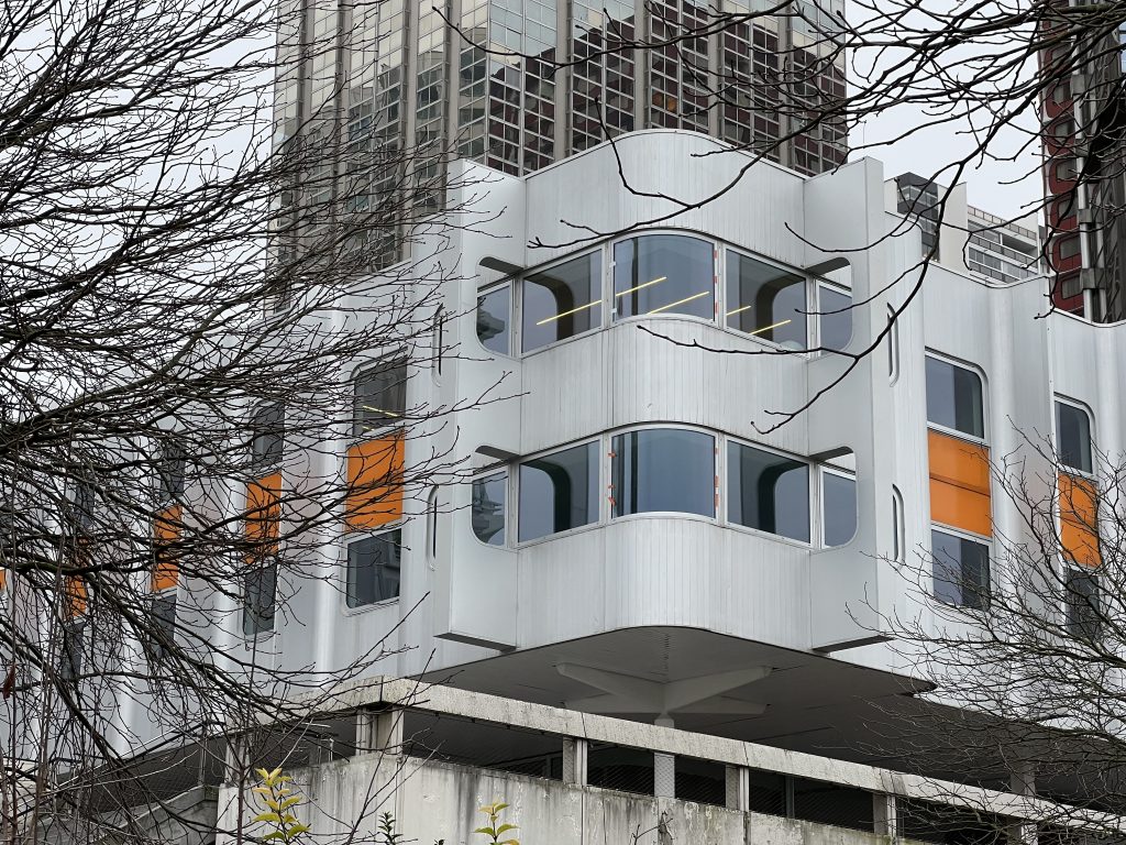 View of Front de Seine featuring buildings with varied materials, geometric shapes, and contrasting colors, highlighting modernist design diversity.