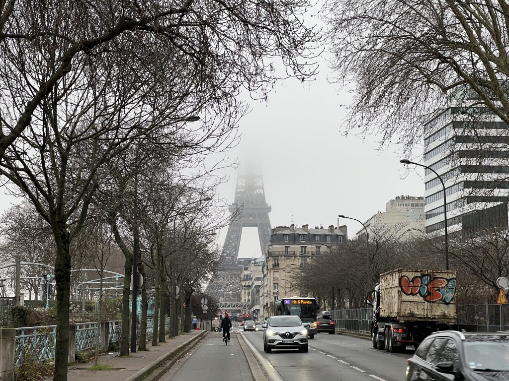 Eiffel Tower partly hidden in the fog close tp Front de Seine