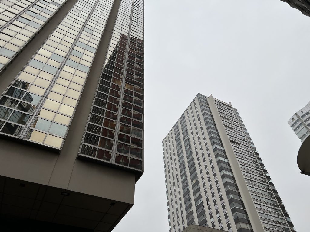 View of Front de Seine featuring buildings with varied materials, geometric shapes, and contrasting colors, highlighting modernist design diversity.