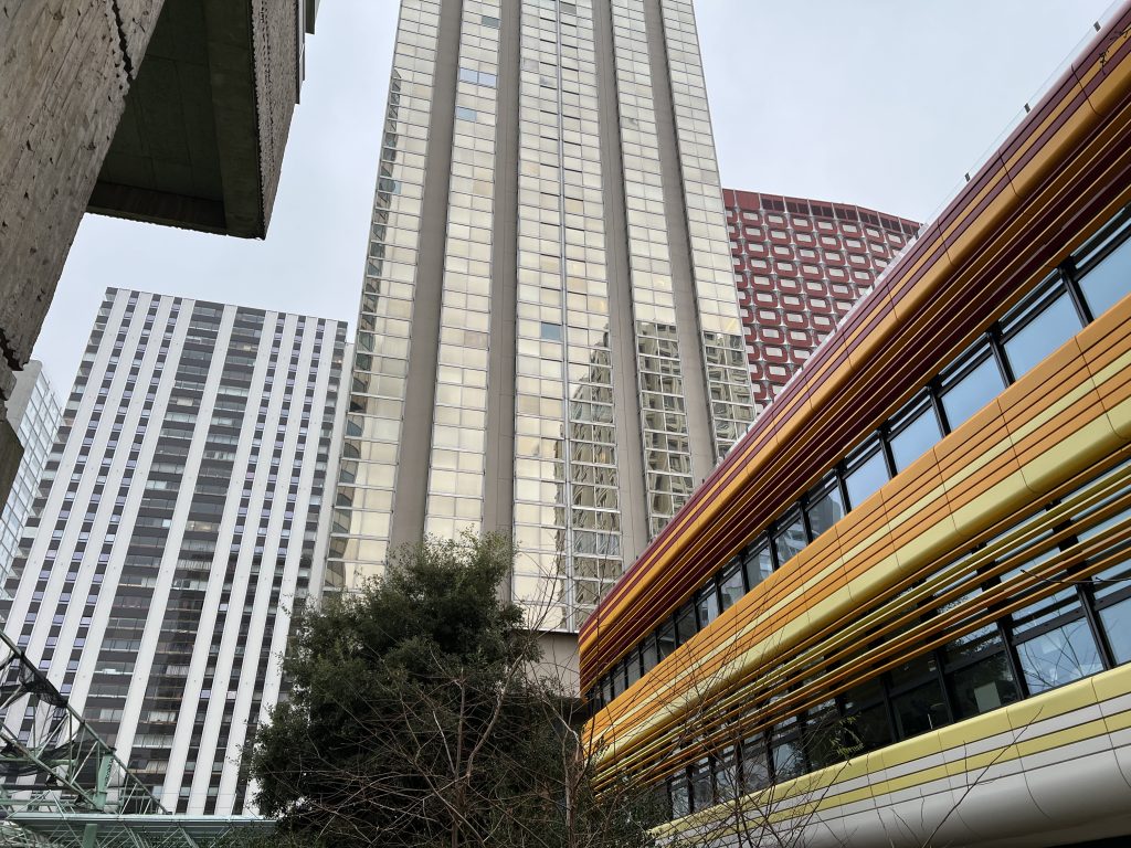 View of Front de Seine featuring buildings with varied materials, geometric shapes, and contrasting colors, highlighting modernist design diversity.